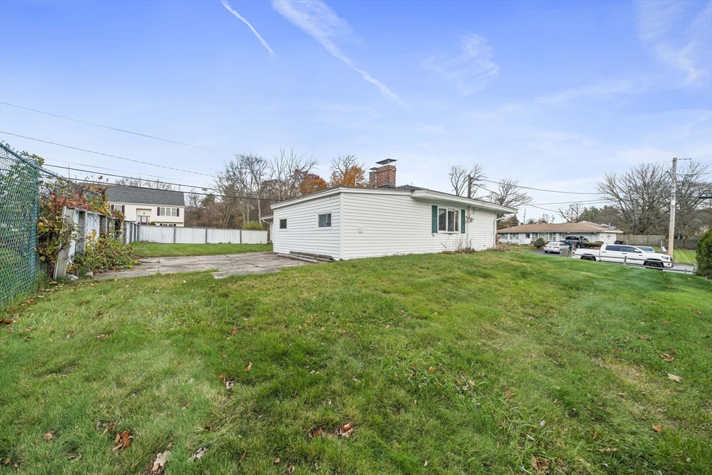 36 Dix Road Brockton, MA 02302 - Photo 4 of 31 a view of a big room with a big yard and large trees