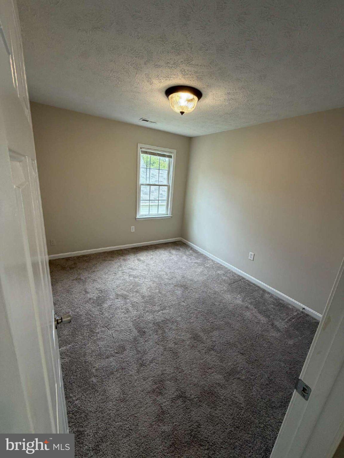 313 3rd Street Colonial Beach, VA 22443 - Photo 17 of 36 Bright and inviting bedroom space.