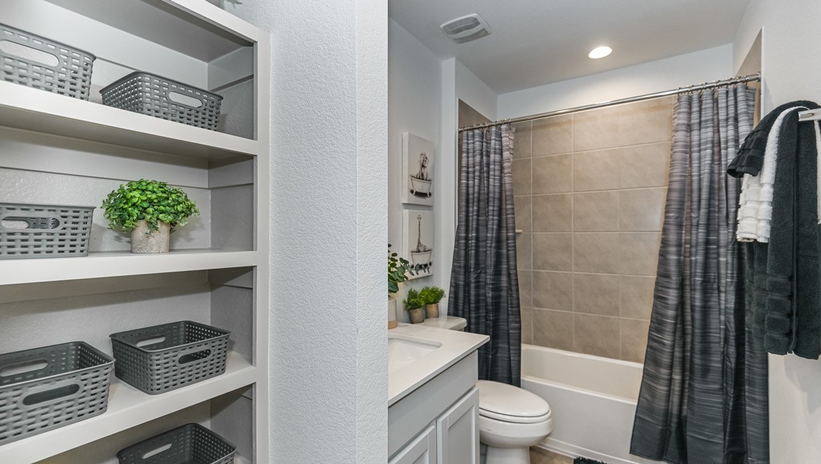 7918 Murciana Drive Rosharon, TX 77583 - Photo 8 of 21 a bathroom with a shower a toilet a sink and a shower