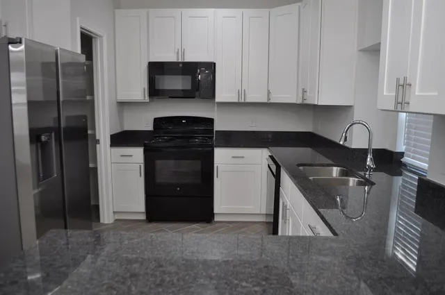 a view of a kitchen from the hallway