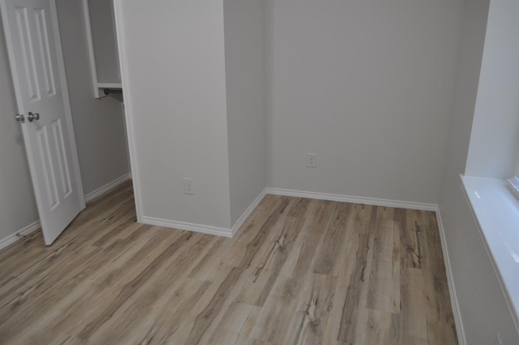 2360 Murphy Court Waxahachie, TX 75165 - Photo 13 of 22 a view of wooden floor in a room