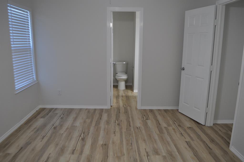 2360 Murphy Court Waxahachie, TX 75165 - Photo 19 of 22 a view of room with window and hardwood floor
