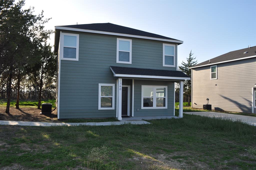 2360 Murphy Court Waxahachie, TX 75165 - Photo 2 of 22 a front view of a house with a yard