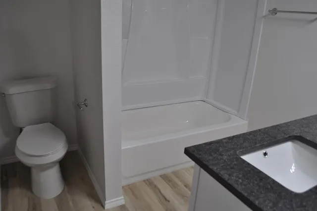 a view of room with window and hardwood floor