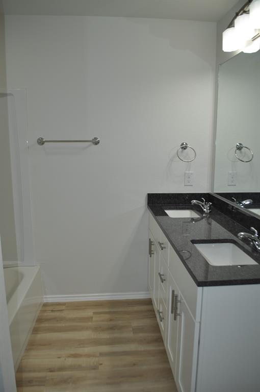 2360 Murphy Court Waxahachie, TX 75165 - Photo 21 of 22 a bathroom with a sink and a mirror