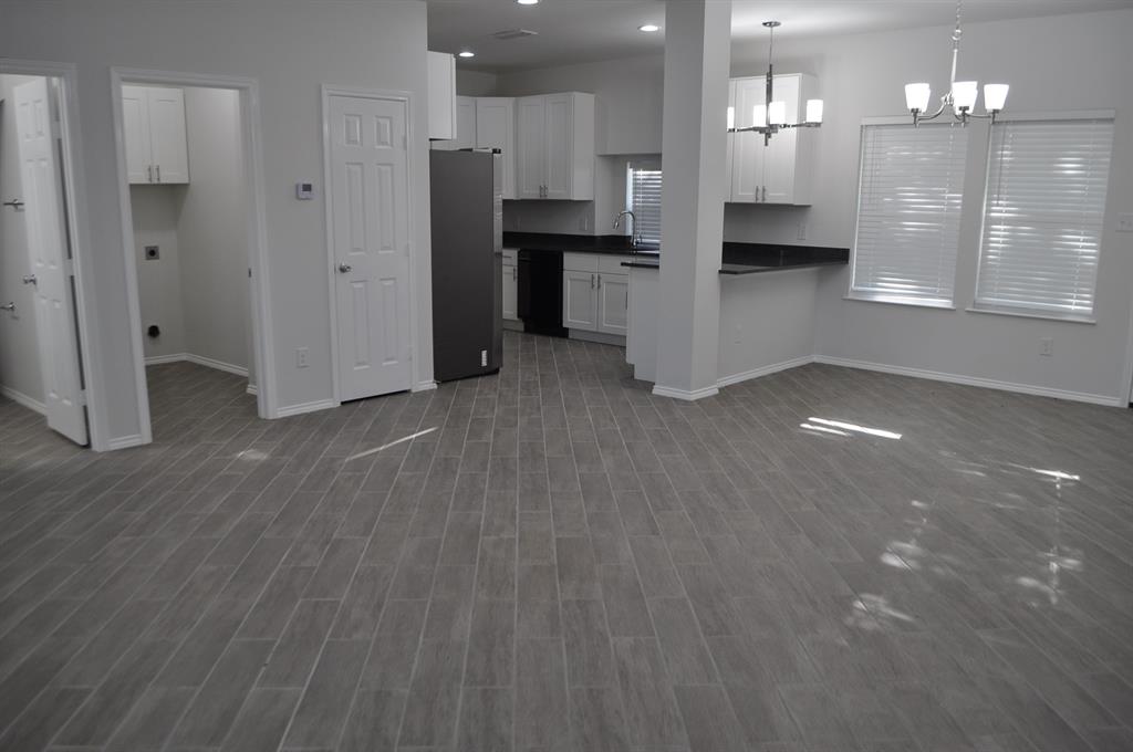 2360 Murphy Court Waxahachie, TX 75165 - Photo 22 of 22 a view of a kitchen with refrigerator and microwave