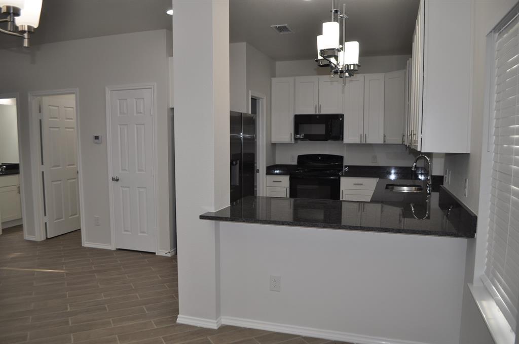 2360 Murphy Court Waxahachie, TX 75165 - Photo 9 of 22 a view of a kitchen from the hallway