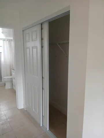 a view of a livingroom and a bathroom