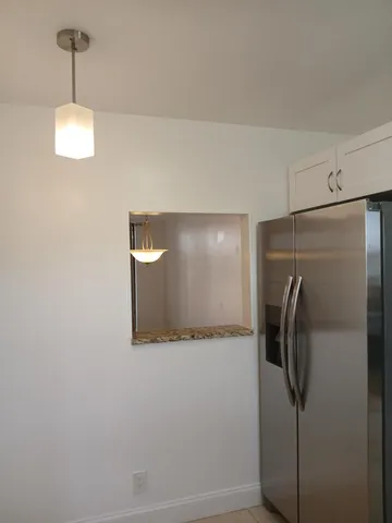 a bathroom with a shower and a mirror