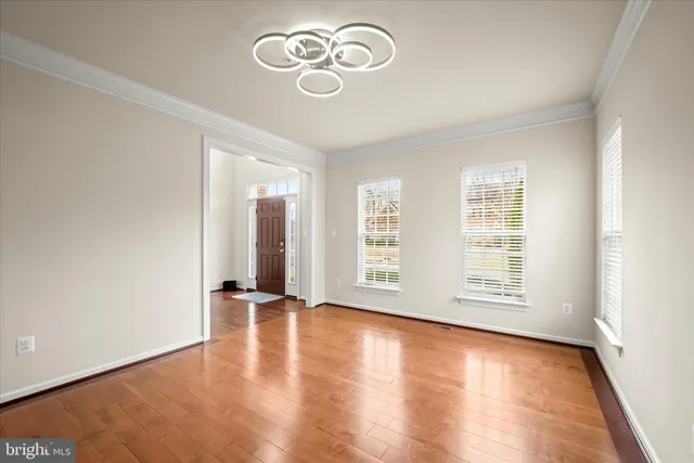 a view of a dining room with furniture and window