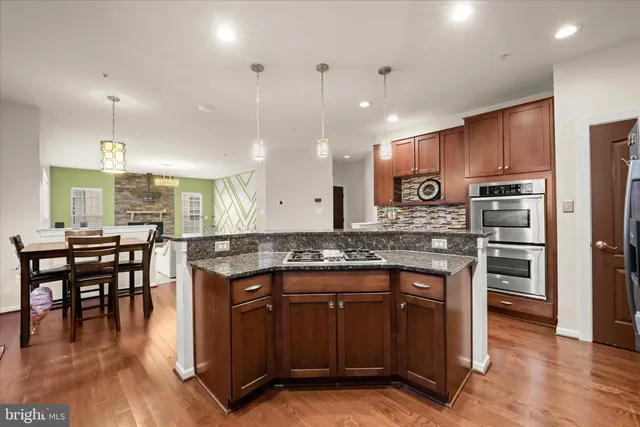 a view of kitchen with dining table and chairs