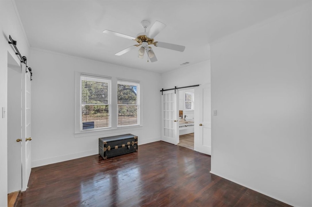 2700 Pine Avenue Waco, TX 76708 - Photo 13 of 29 wooden floor in an empty room with a window