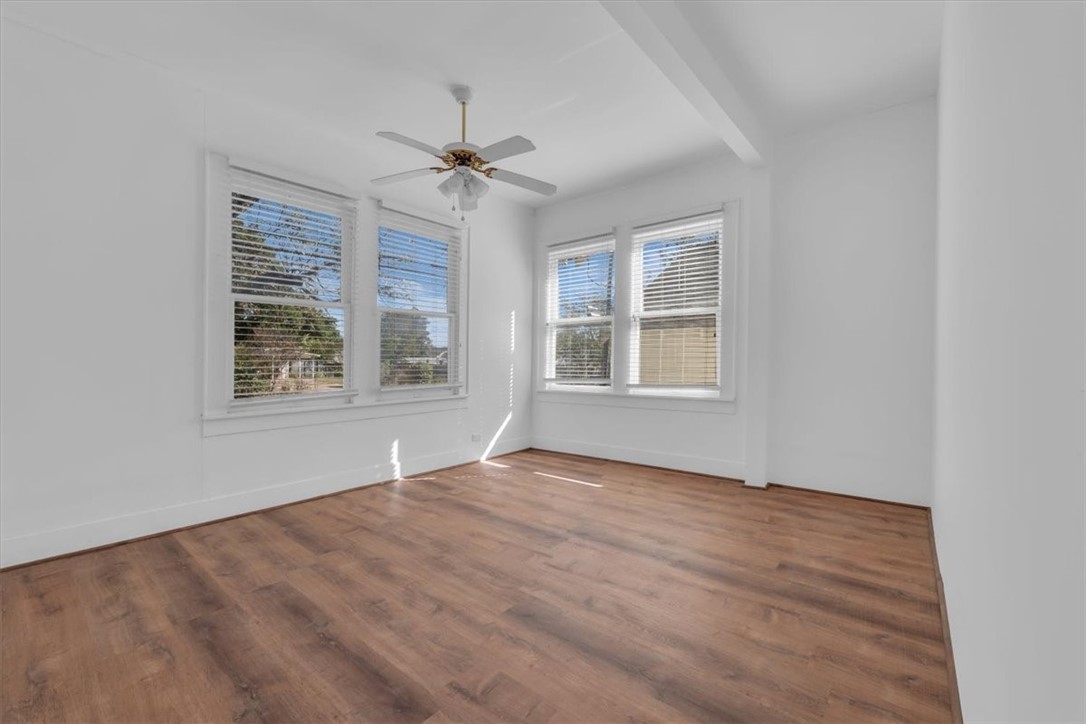 2700 Pine Avenue Waco, TX 76708 - Photo 16 of 29 a view of an empty room with a window and wooden floor