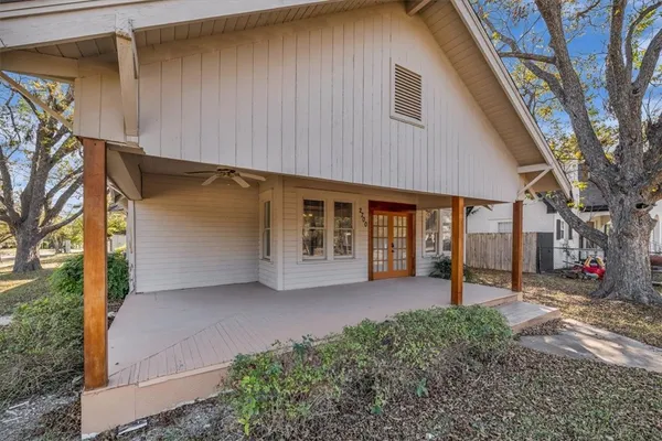 a house with a tree in front of it