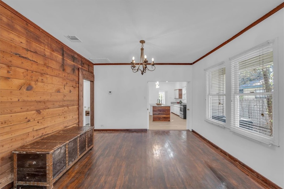 2700 Pine Avenue Waco, TX 76708 - Photo 7 of 29 a view of a livingroom with wooden floor and a ceiling fan