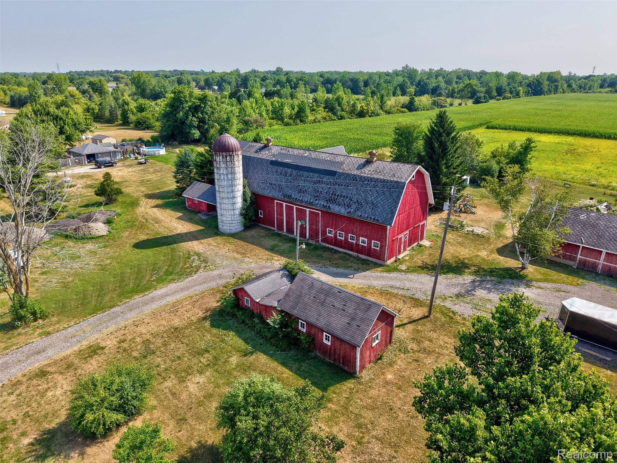 1175 South Morrish Road Flint, MI 48532 - Photo 63 of 72 Red barn with a dark-pitched roof and multiple windows
