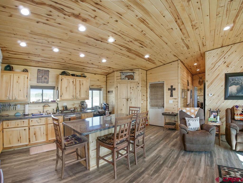 29200 Rd T.5 Dolores, CO 81323 - Photo 15 of 27 a view of a dining room with furniture window and wooden floor