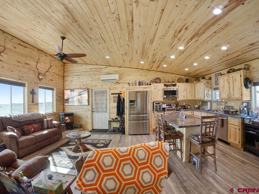 29200 Rd T.5 Dolores, CO 81323 - Photo 17 of 27 a living room with lots of furniture and kitchen view