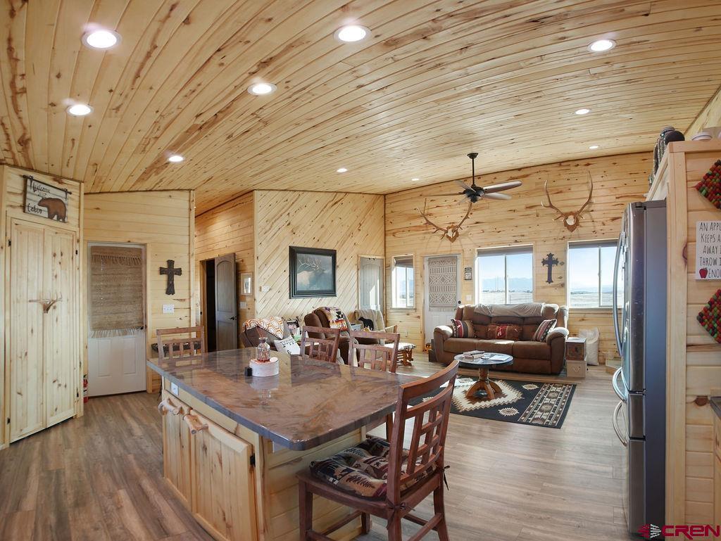 29200 Rd T.5 Dolores, CO 81323 - Photo 19 of 27 a view of a dining room with furniture window and wooden floor