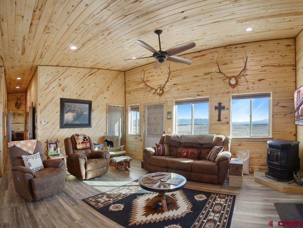 29200 Rd T.5 Dolores, CO 81323 - Photo 20 of 27 a living room with furniture ceiling fan and a rug