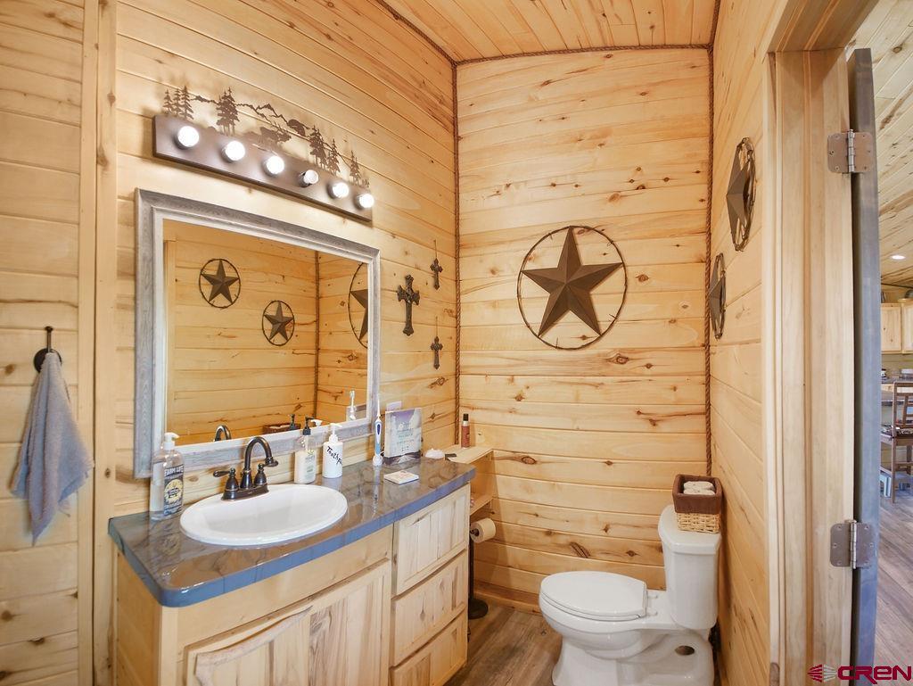 29200 Rd T.5 Dolores, CO 81323 - Photo 22 of 27 a bathroom with a granite countertop sink toilet and a mirror