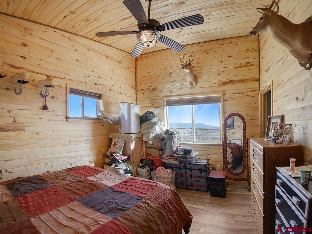 29200 Rd T.5 Dolores, CO 81323 - Photo 24 of 27 a bed sitting in a room next to a window