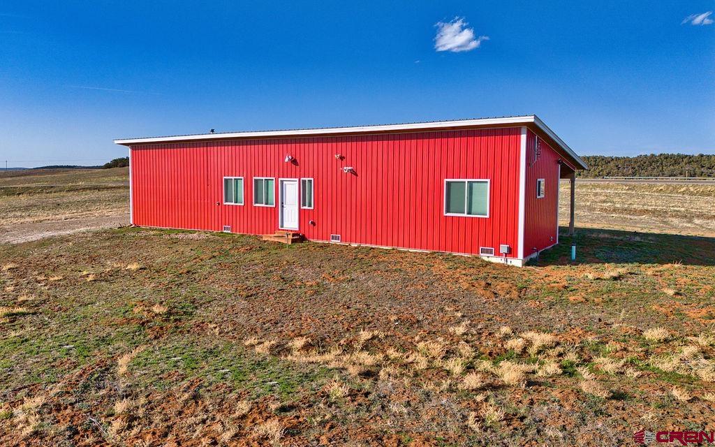 29200 Rd T.5 Dolores, CO 81323 - Photo 6 of 27 a building with trees in front of it