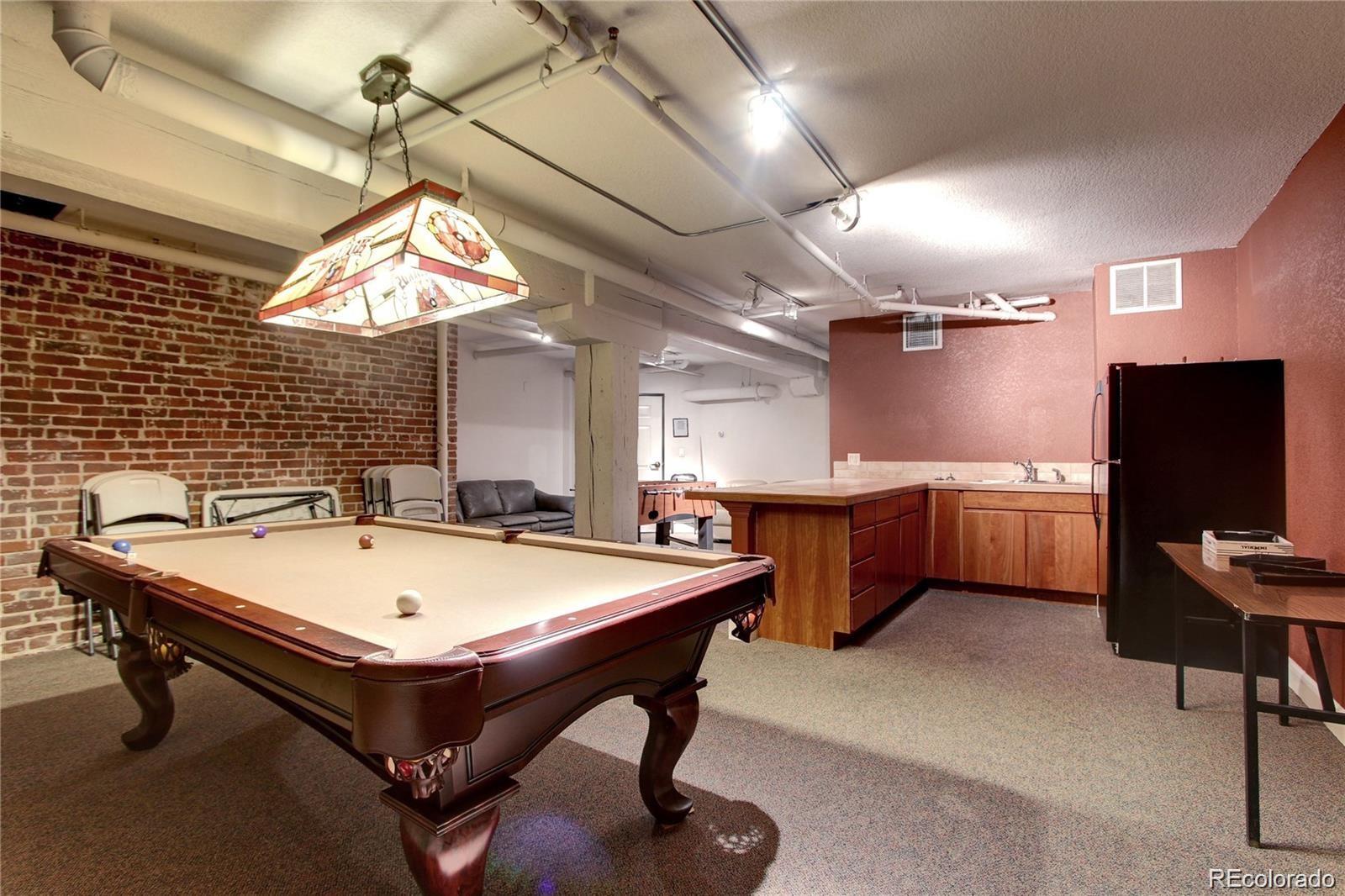 2560 Blake Street, Unit 203 Denver, CO 80205 - Photo 22 of 23 a room with chairs and tables