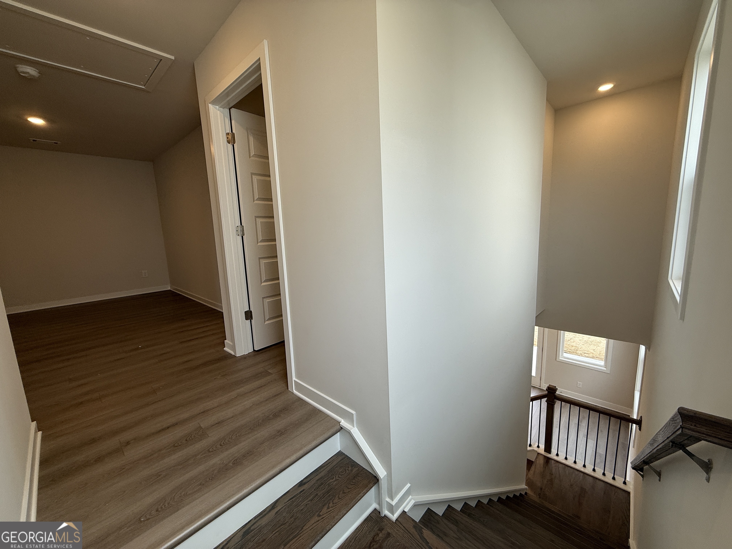 177 Depot Landing Road, Unit 26A Auburn, GA 30011 - Photo 11 of 41 a view of a hallway with wooden floor and staircase