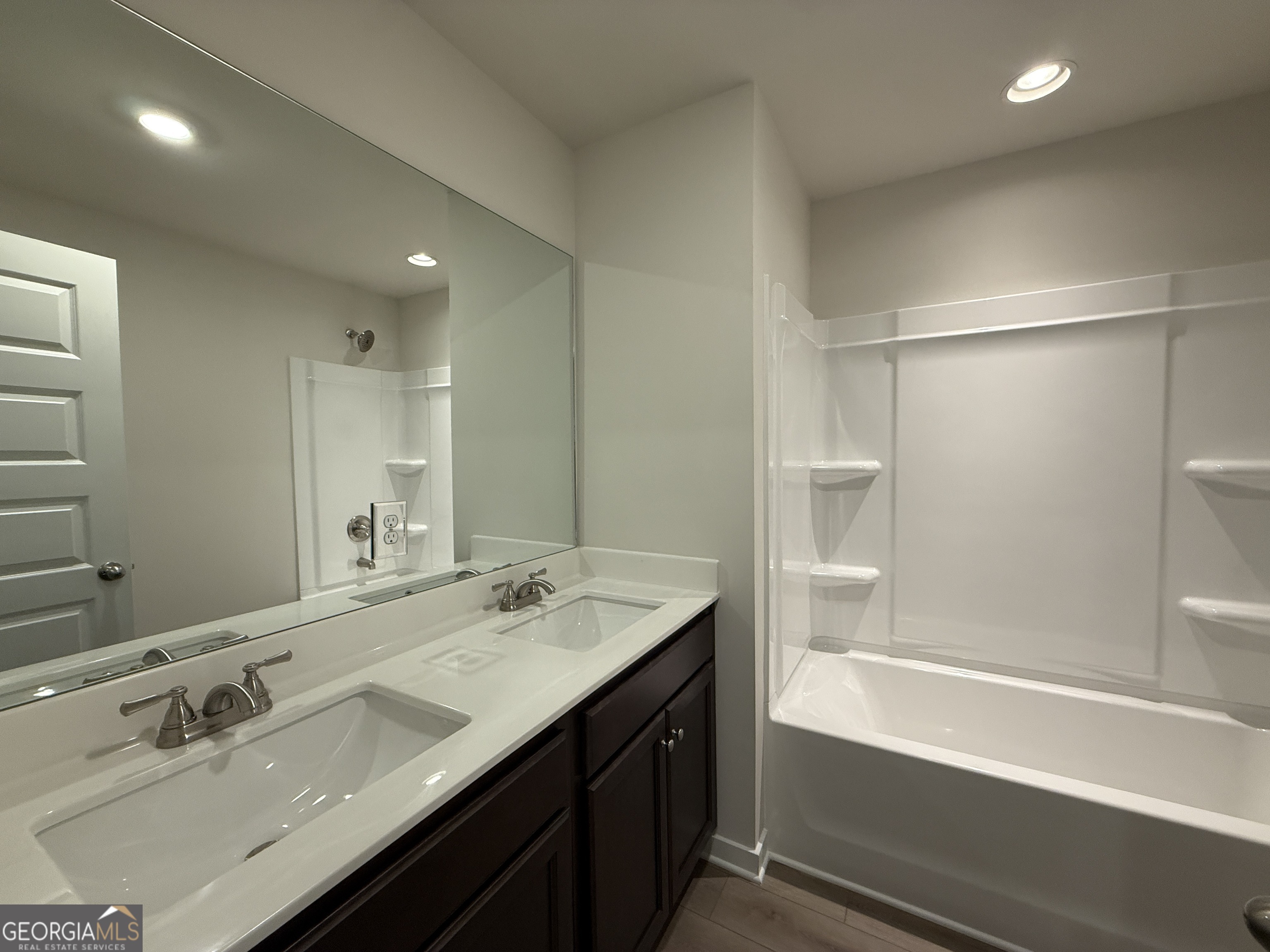 177 Depot Landing Road, Unit 26A Auburn, GA 30011 - Photo 17 of 41 a bathroom with a sink double vanity granite tub shower and a mirror