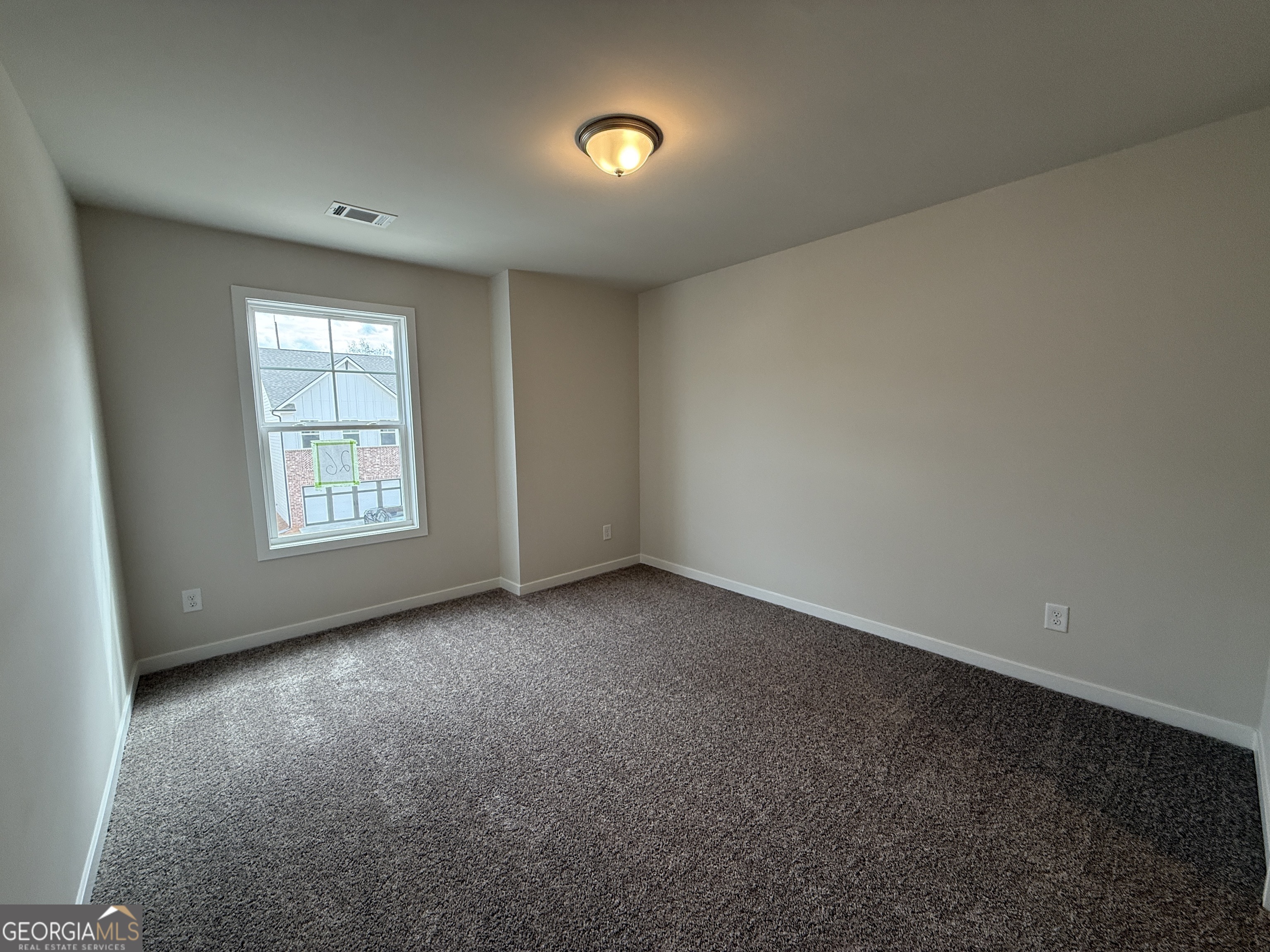 177 Depot Landing Road, Unit 26A Auburn, GA 30011 - Photo 19 of 41 a view of an empty room with a window