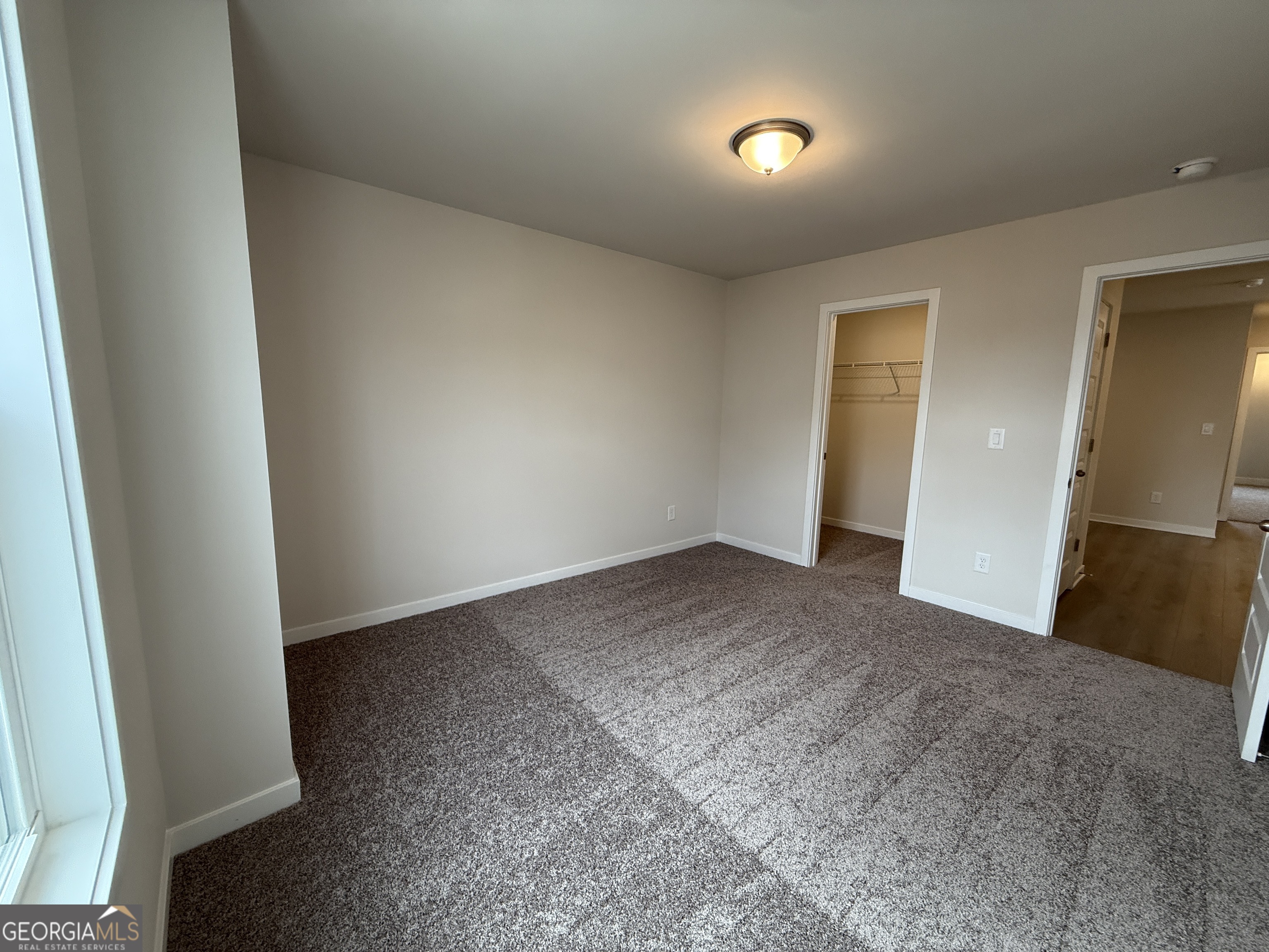 177 Depot Landing Road, Unit 26A Auburn, GA 30011 - Photo 20 of 41 a view of an empty room and wooden floor
