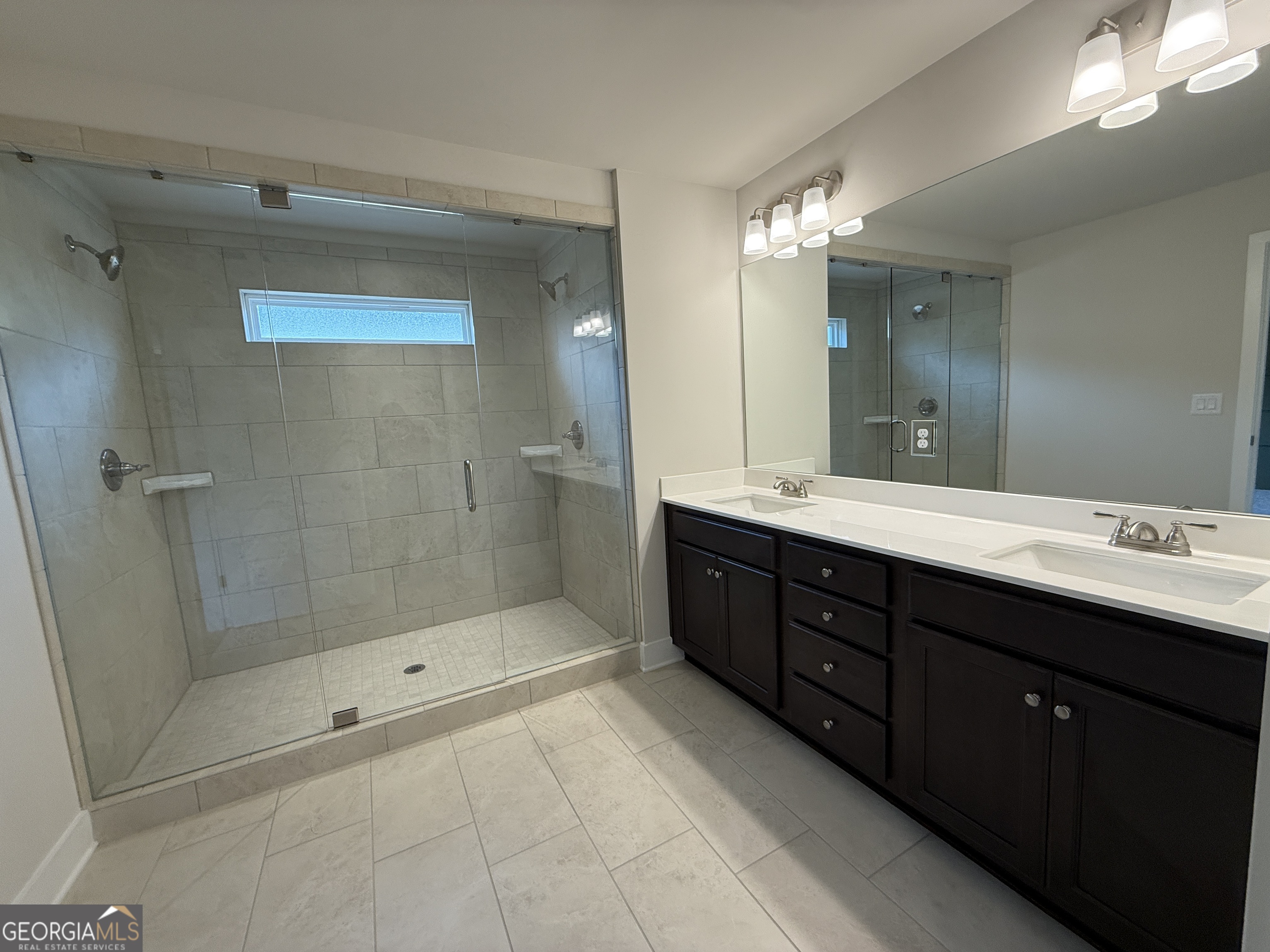 177 Depot Landing Road, Unit 26A Auburn, GA 30011 - Photo 25 of 41 a bathroom with a double vanity sink mirror and shower