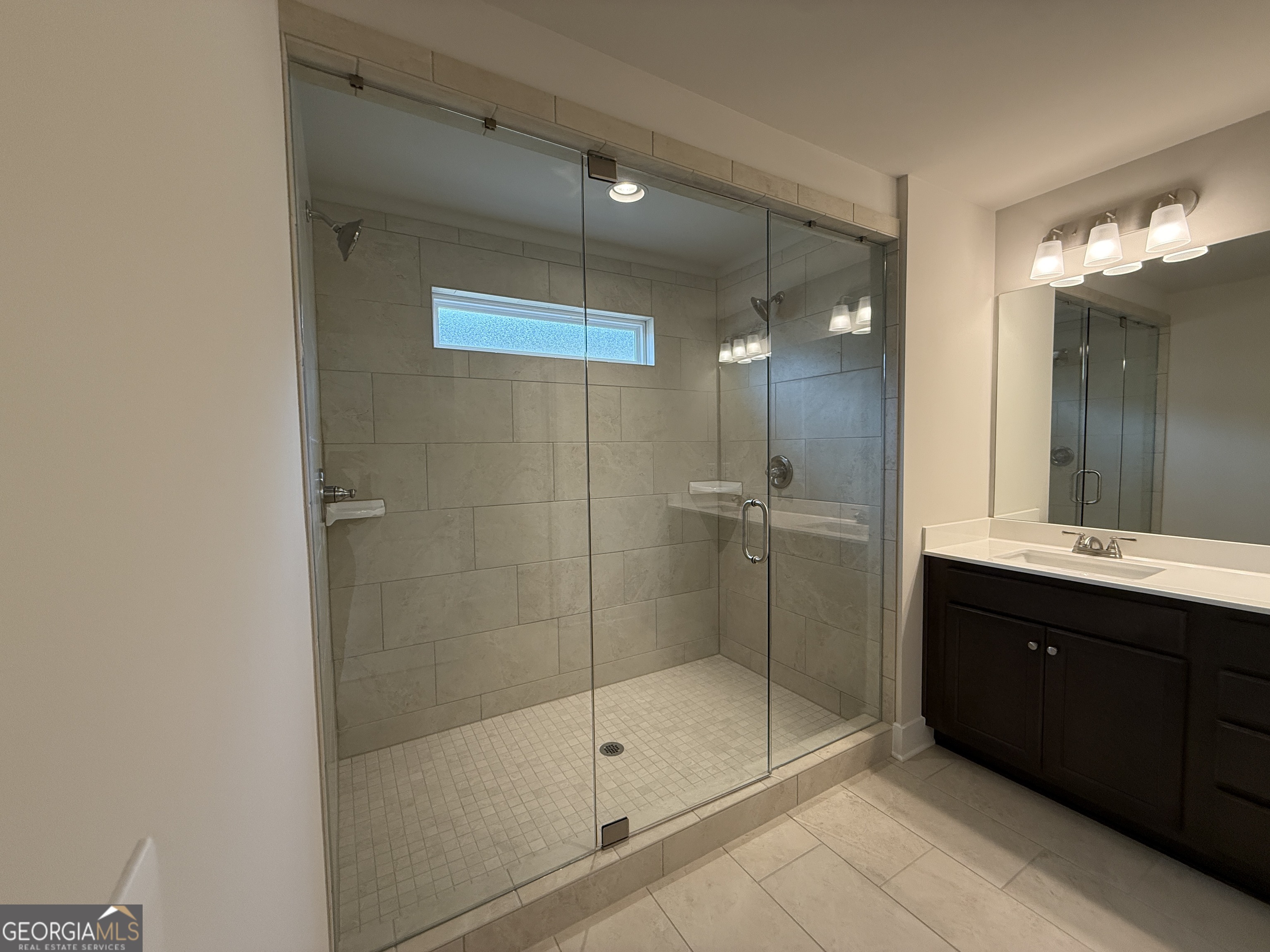 177 Depot Landing Road, Unit 26A Auburn, GA 30011 - Photo 27 of 41 a bathroom with a shower and a sink