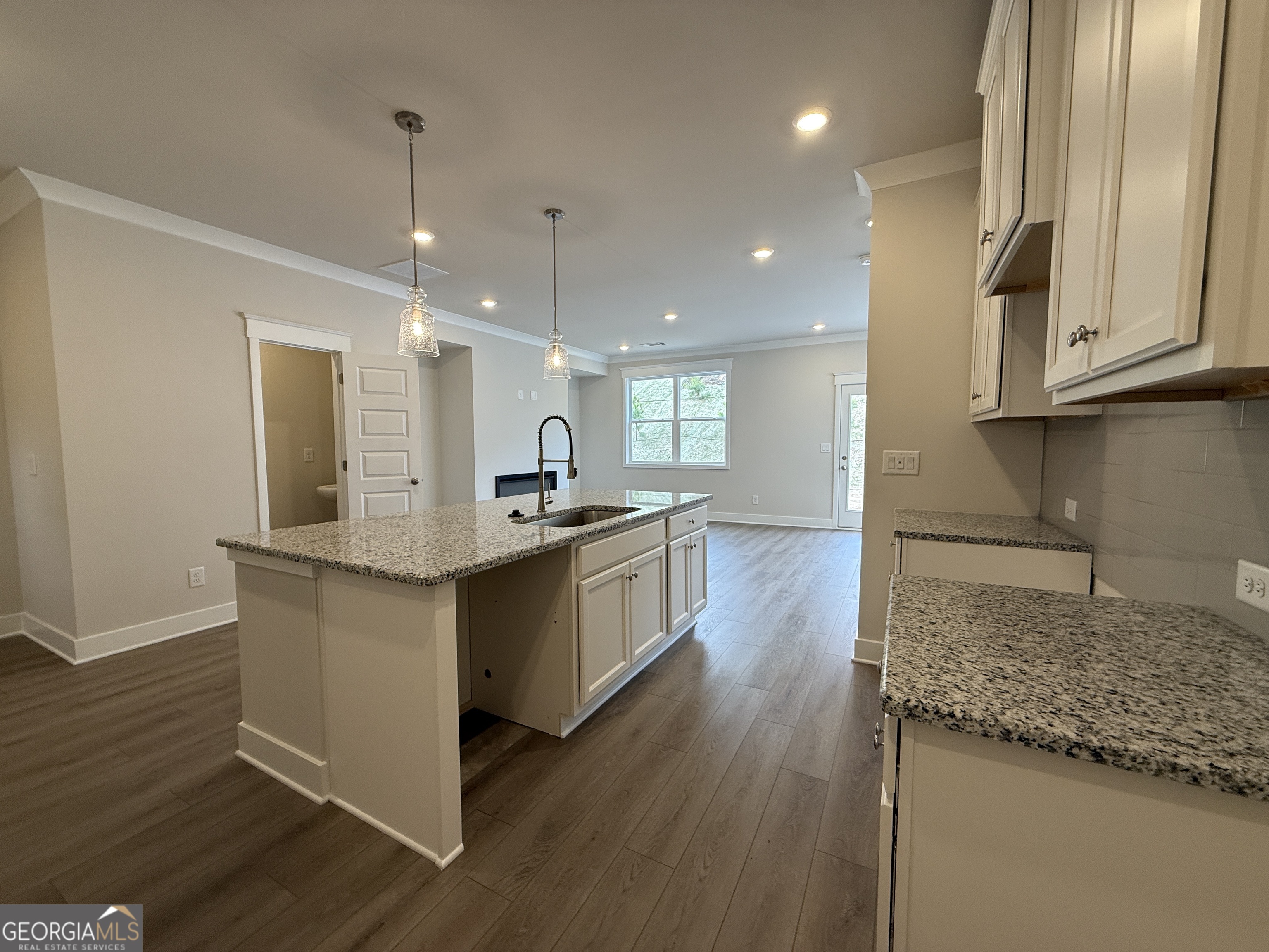 177 Depot Landing Road, Unit 26A Auburn, GA 30011 - Photo 6 of 41 a large kitchen with stainless steel appliances granite countertop a lot of counter space and wooden floor