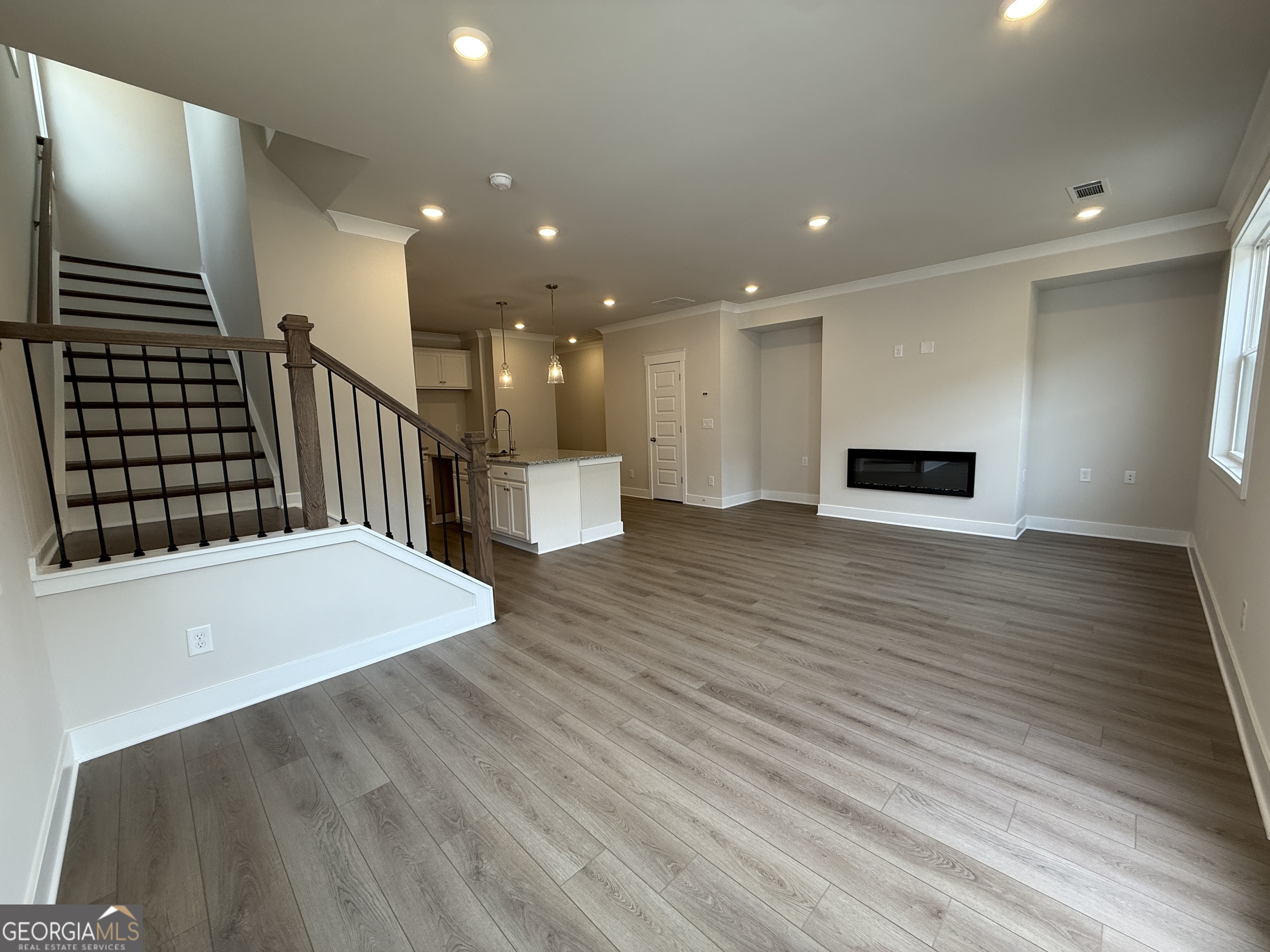 177 Depot Landing Road, Unit 26A Auburn, GA 30011 - Photo 8 of 41 a view of empty room with wooden floor