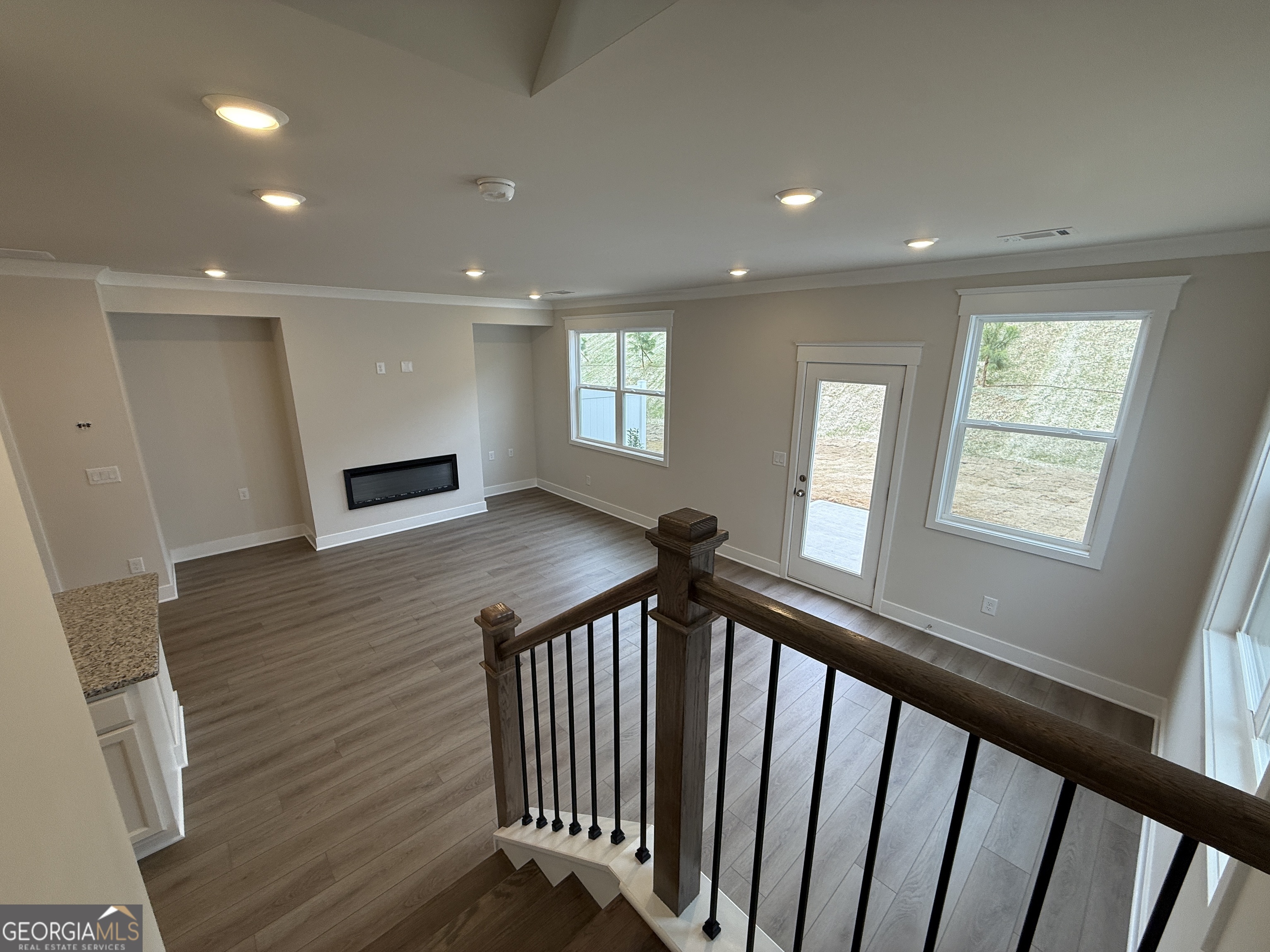 177 Depot Landing Road, Unit 26A Auburn, GA 30011 - Photo 10 of 41 a view of a hallway with wooden floor and staircase