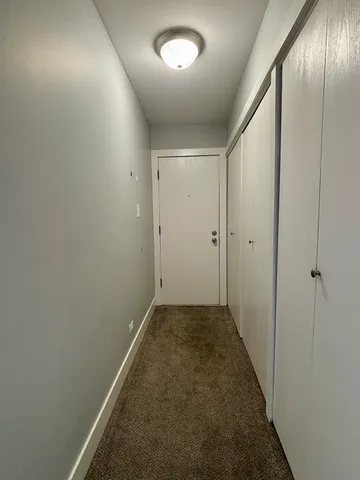 an empty room with closet area