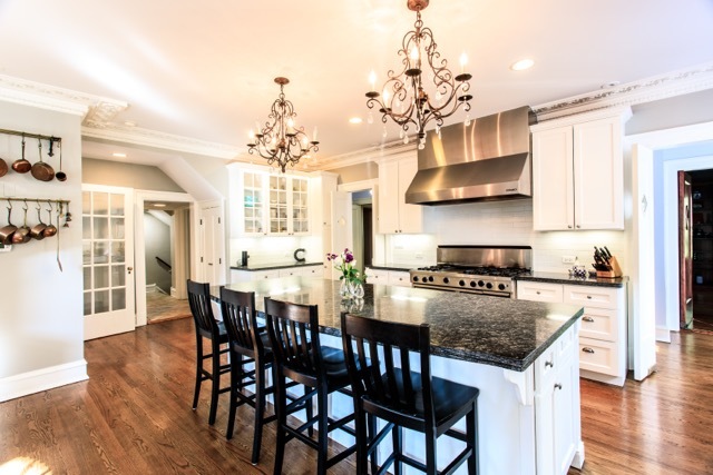 1111 Sheridan Road Wilmette, IL 60091 - Photo 20 of 76 a kitchen with stainless steel appliances granite countertop a kitchen island a stove and a dining table