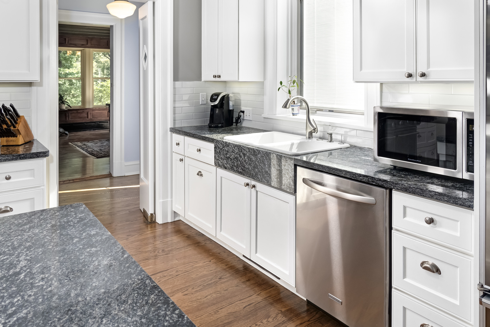 1111 Sheridan Road Wilmette, IL 60091 - Photo 24 of 76 a kitchen with stainless steel appliances granite countertop a stove a sink and a microwave