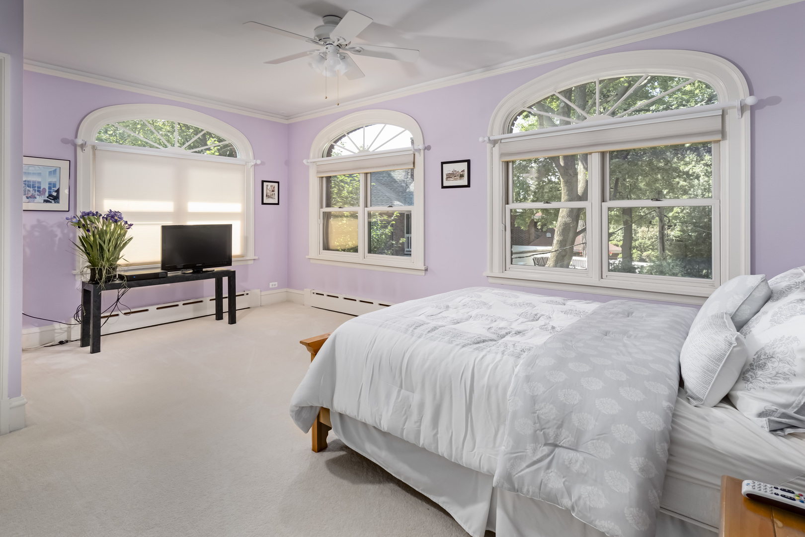 1111 Sheridan Road Wilmette, IL 60091 - Photo 44 of 76 a bedroom with a bed flat screen tv and a large window