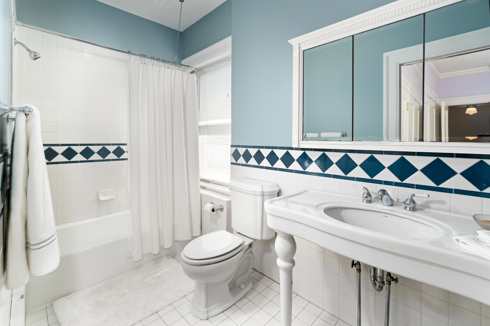 1111 Sheridan Road Wilmette, IL 60091 - Photo 53 of 76 a bathroom with a sink a toilet and shower