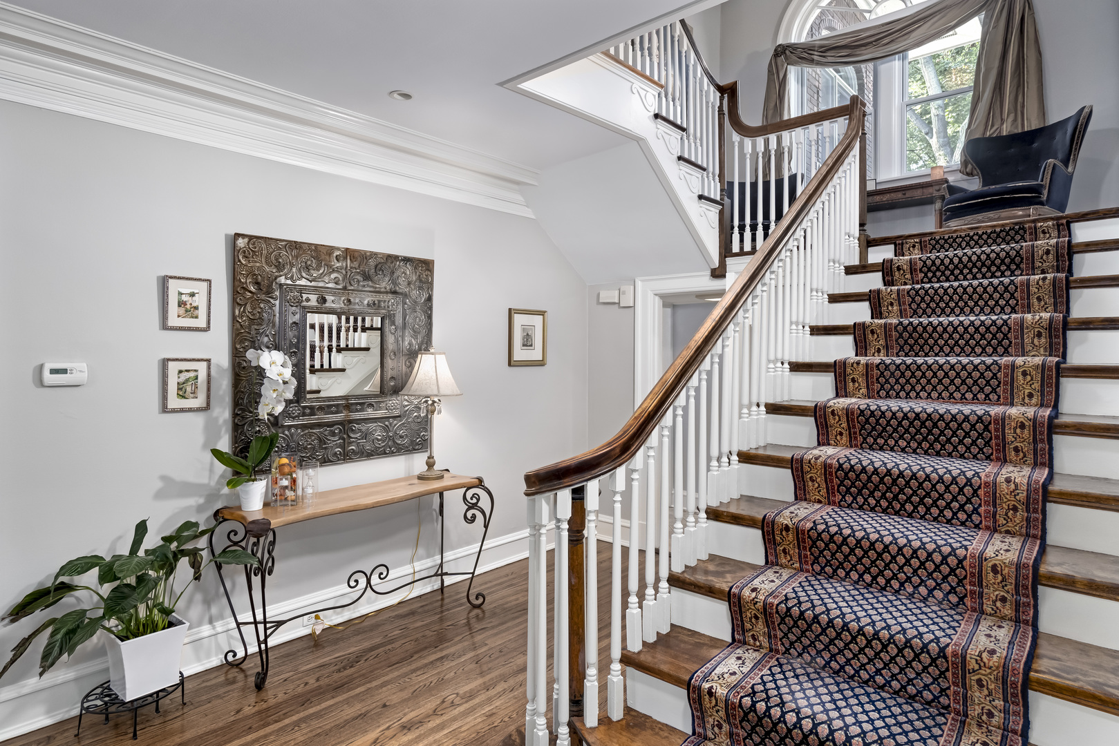 1111 Sheridan Road Wilmette, IL 60091 - Photo 7 of 76 a view of entryway with wooden floor and stairs