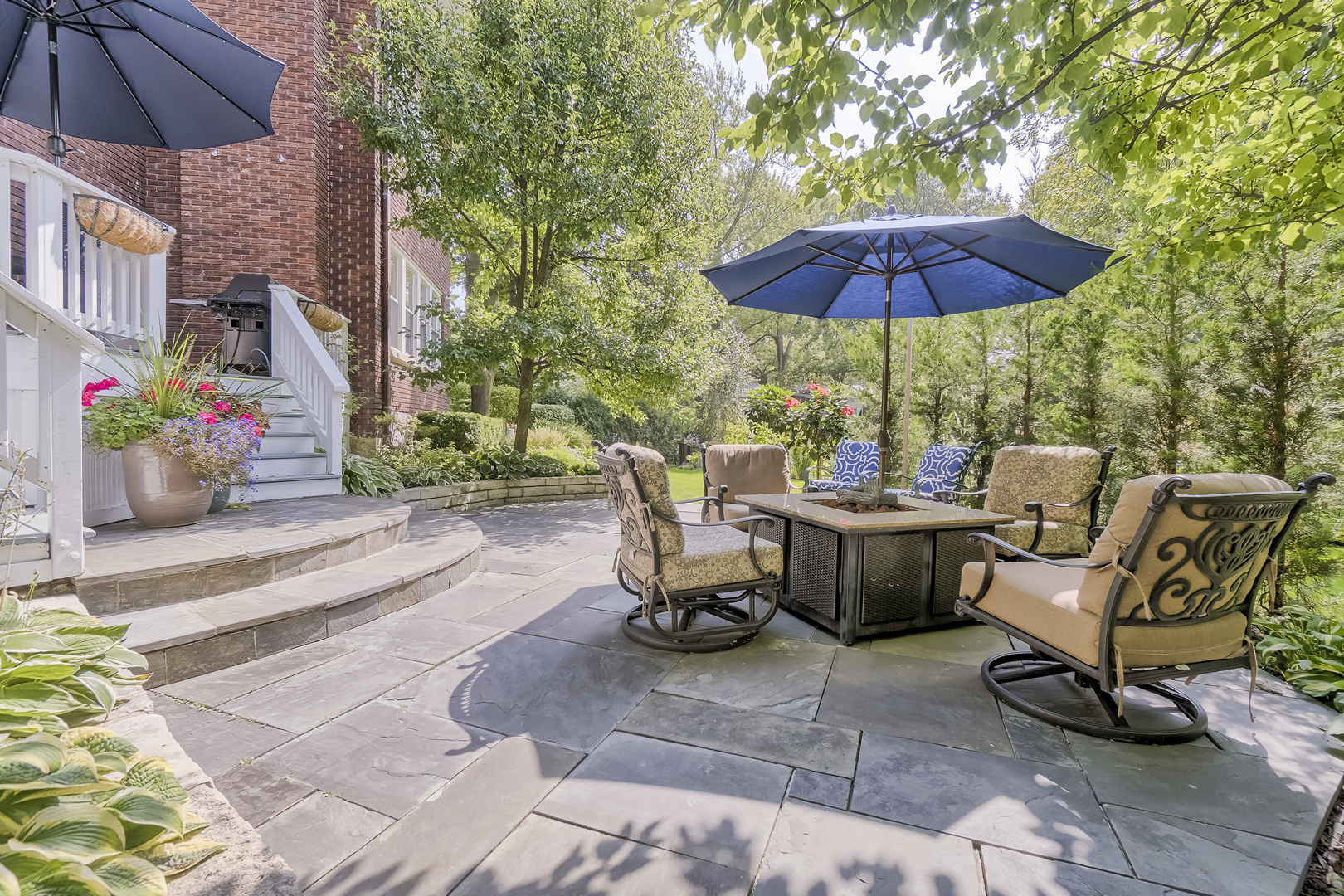 1111 Sheridan Road Wilmette, IL 60091 - Photo 66 of 76 a view of a patio with a table and chairs under an umbrella