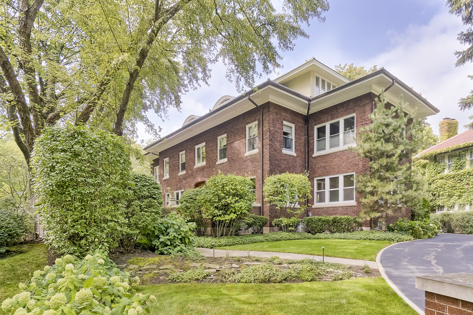 1111 Sheridan Road Wilmette, IL 60091 - Photo 72 of 76 a view of a big house with a big yard and large trees
