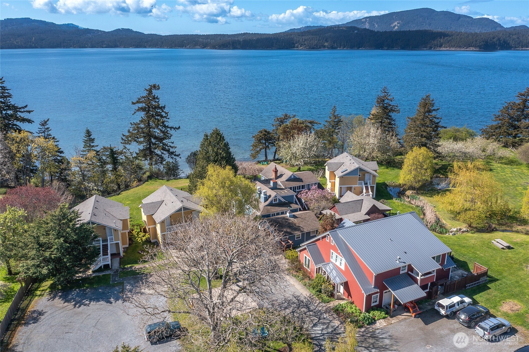 326 Olga Road Orcas Island, WA 98245 - Photo 1 of 39 an aerial view of a house with garden space and lake view