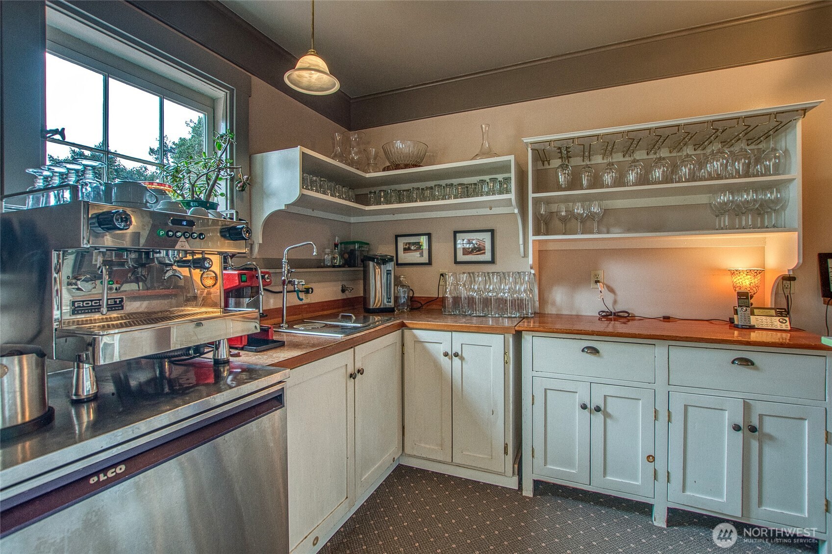 326 Olga Road Orcas Island, WA 98245 - Photo 11 of 39 a kitchen with white cabinets and window