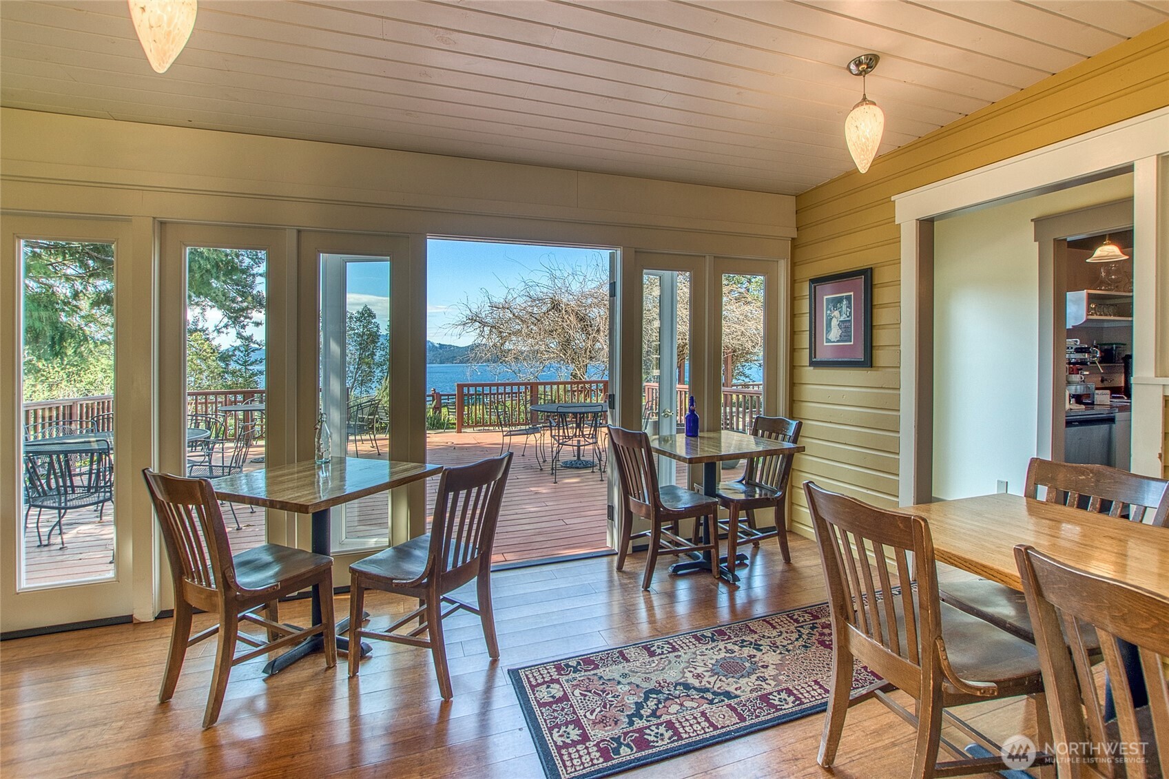 326 Olga Road Orcas Island, WA 98245 - Photo 20 of 39 a view of a dining room with furniture window and wooden floor