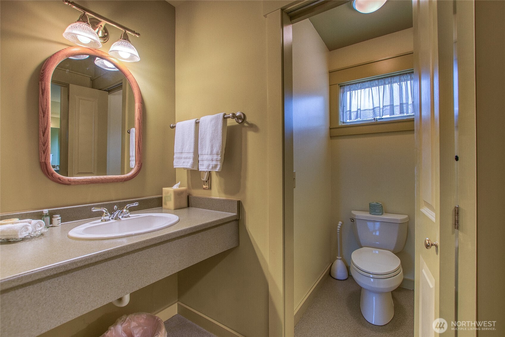 326 Olga Road Orcas Island, WA 98245 - Photo 28 of 39 a bathroom with a toilet a sink and mirror