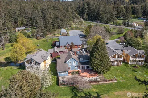 an aerial view of a house with a yard